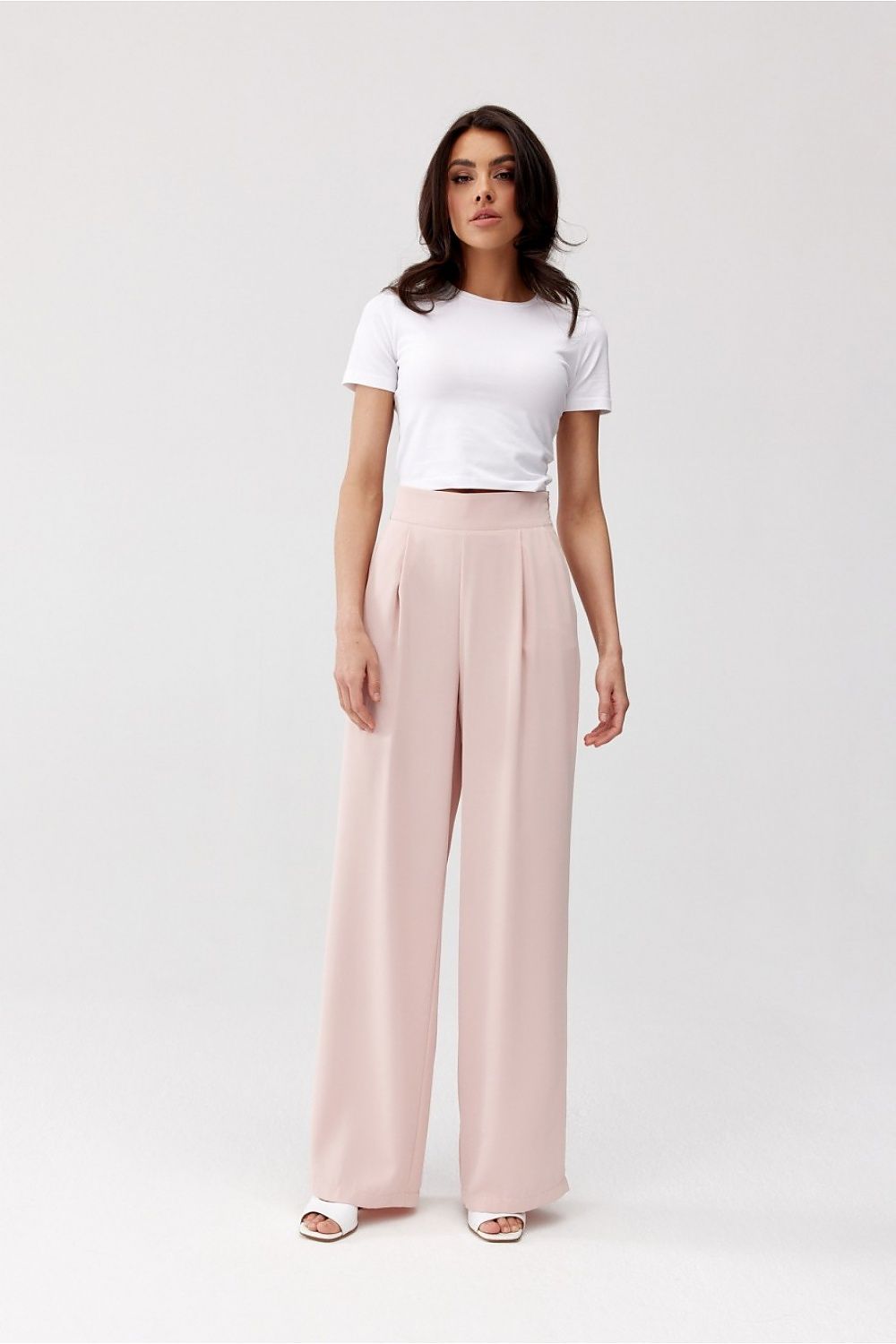Pantalon large taille haute rose poudré pour femme, coupe élégante et fluide, fabriqué en Europe.